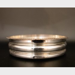 Vintage silver-plated wine bottle coaster with wooden base