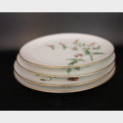 Set of 4 hand-painted botanical porcelain plates (20 cm in diametre), signed E.J. and dated 1961
