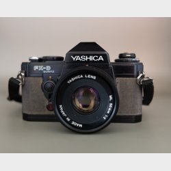 Vintage Yashica FX-D Quartz 35mm SLR Camera Kit � 50mm f/2 Lens + Telephoto Zoom Lenses, Sunpak Auto Zoom 3000 Flash &amp; Leather Hard Case (Japan, 1980s)