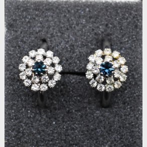 Elegant vintage-inspired jewelry set consisting of a matching ring and pair of stud earrings