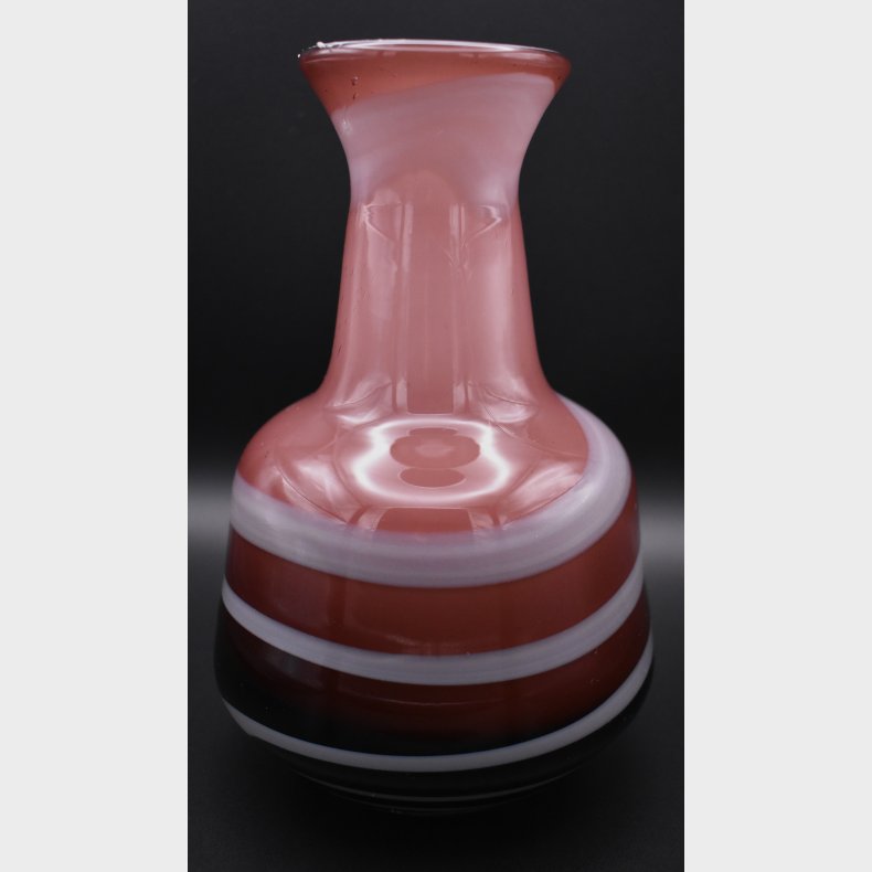 Decorative art glass vase in a striking red and white color combination